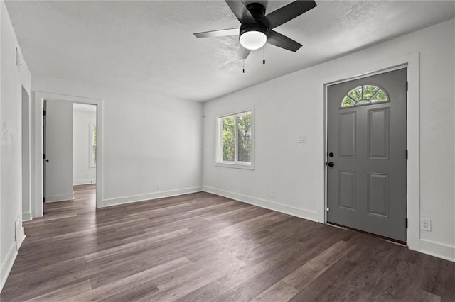 6 W 98th Ter, Kansas City, MO 64114 - entryway with a textured ceiling, wood finished floors, ceiling fan, and baseboards