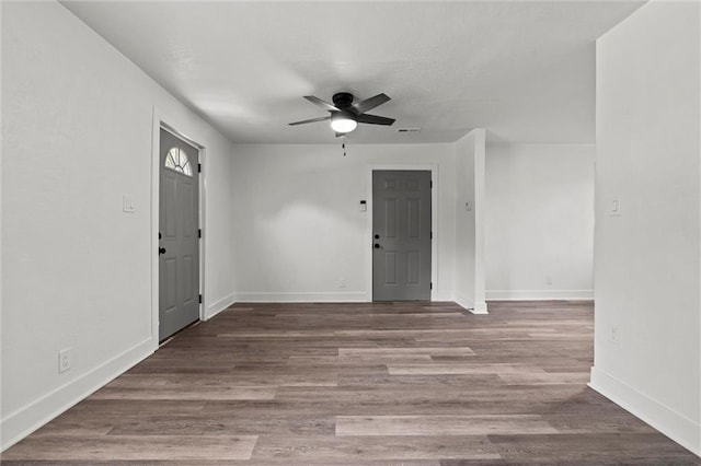 6 W 98th Ter, Kansas City, MO 64114 - entrance foyer with a ceiling fan, baseboards, and wood finished floors