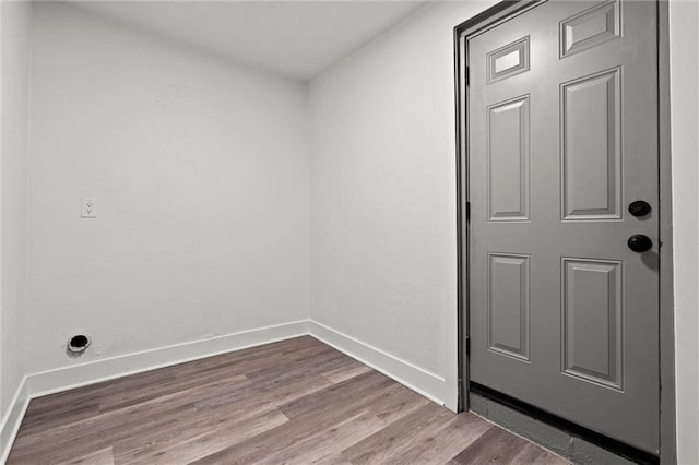 6 W 98th Ter, Kansas City, MO 64114 - laundry room with wood finished floors and baseboards