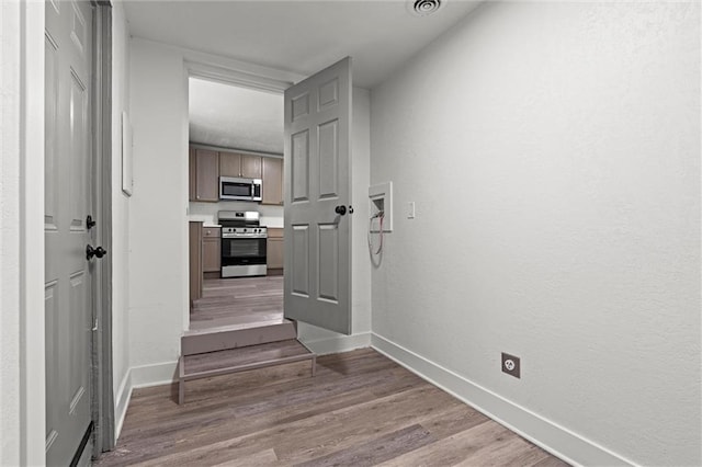 6 W 98th Ter, Kansas City, MO 64114 - hallway featuring baseboards and light wood finished floors