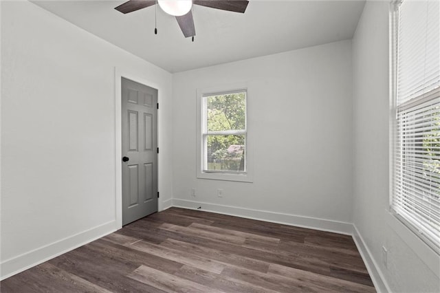 6 W 98th Ter, Kansas City, MO 64114 - unfurnished room featuring ceiling fan, dark wood finished floors, and baseboards