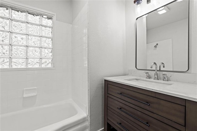 6 W 98th Ter, Kansas City, MO 64114 - bathroom featuring plenty of natural light, vanity, bathtub / shower combination, and a textured wall