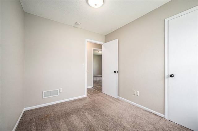214 NW Parker Dr, Grain Valley, MO 64029 - unfurnished bedroom with carpet and baseboards