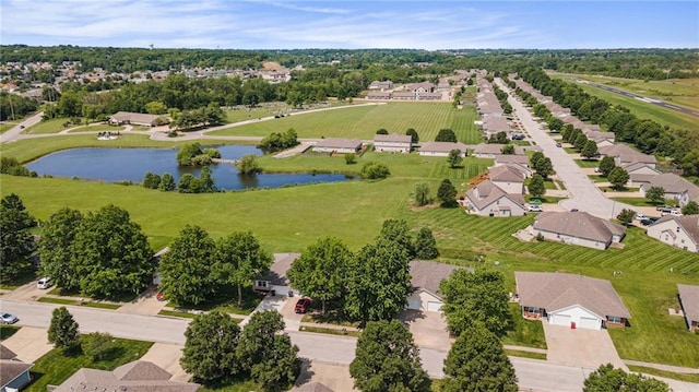 214 NW Parker Dr, Grain Valley, MO 64029 - aerial view of residential area with a large body of water