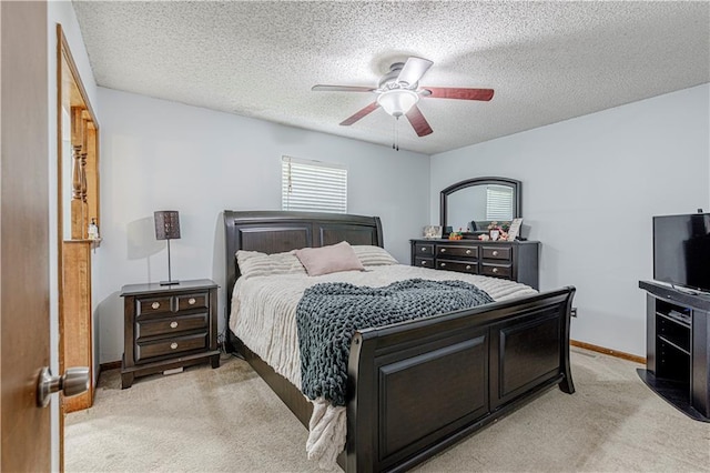 516 S St, Grain Valley, MO 64029 - bedroom with light carpet, a textured ceiling, and ceiling fan