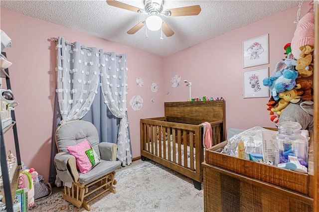 516 S St, Grain Valley, MO 64029 - bedroom featuring a textured ceiling and a ceiling fan