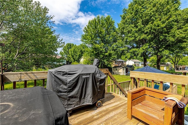 516 S St, Grain Valley, MO 64029 - wooden terrace with area for grilling