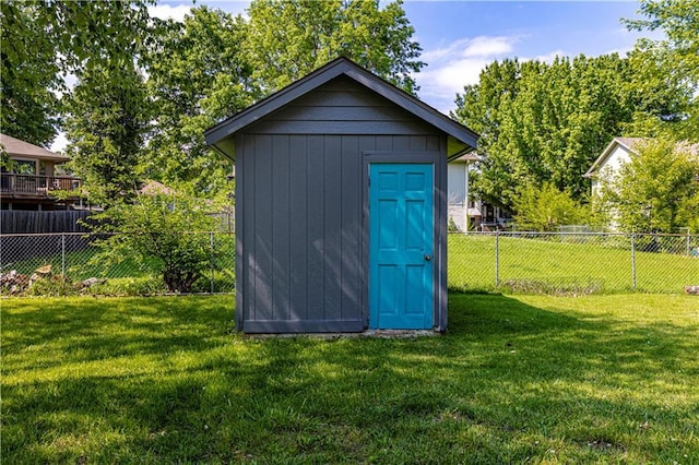 516 S St, Grain Valley, MO 64029 - view of shed featuring a fenced backyard