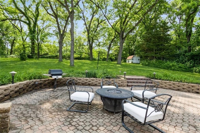 5308 Foster St, Overland Park, KS 66202 - view of patio / terrace featuring a fire pit and view of wooded area