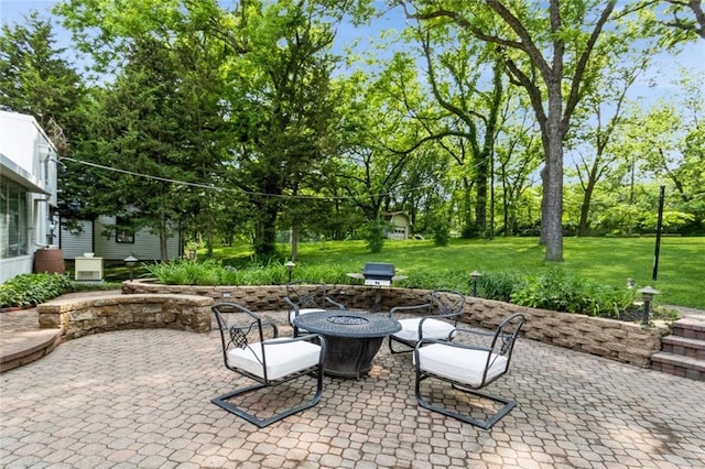 5308 Foster St, Overland Park, KS 66202 - view of patio featuring an outdoor fire pit and view of wooded area