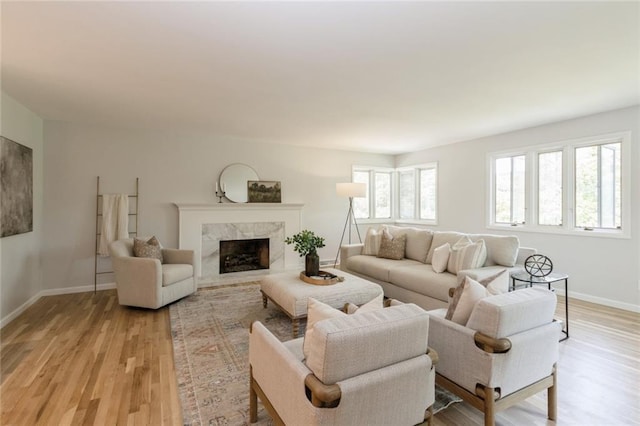 5308 Foster St, Overland Park, KS 66202 - living room with light wood-style flooring, baseboards, and a premium fireplace