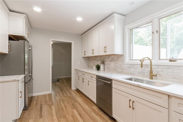 5308 Foster St, Overland Park, KS 66202 - kitchen featuring stainless steel appliances, a sink, backsplash, baseboards, and recessed lighting