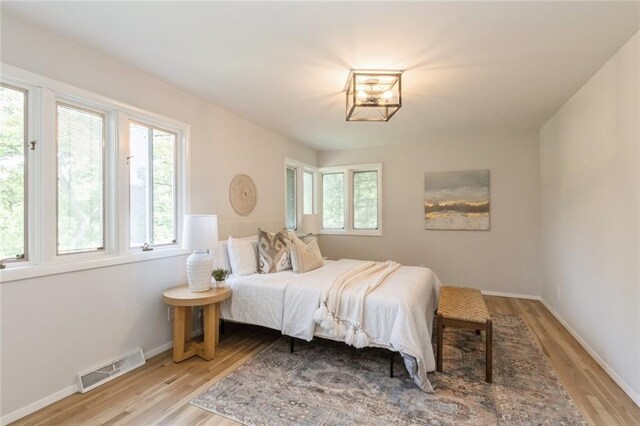 5308 Foster St, Overland Park, KS 66202 - bedroom with light wood-type flooring and baseboards
