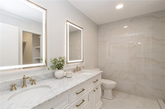 5308 Foster St, Overland Park, KS 66202 - full bathroom with double vanity, marble finish flooring, toilet, a shower, and recessed lighting