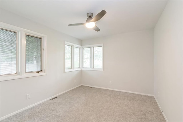 5308 Foster St, Overland Park, KS 66202 - unfurnished room with light colored carpet, a ceiling fan, and baseboards