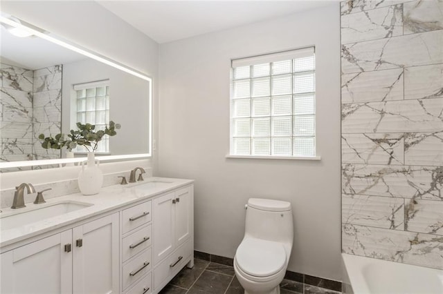 5308 Foster St, Overland Park, KS 66202 - full bath with double vanity, toilet, baseboards, and bathing tub / shower combination