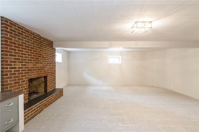 5308 Foster St, Overland Park, KS 66202 - below grade area featuring carpet, plenty of natural light, and a brick fireplace
