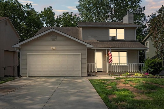 446 Hithergreen Dr, Lansing, KS 66043 - view of front of home with a porch, an attached garage, concrete driveway, a chimney, and roof with shingles