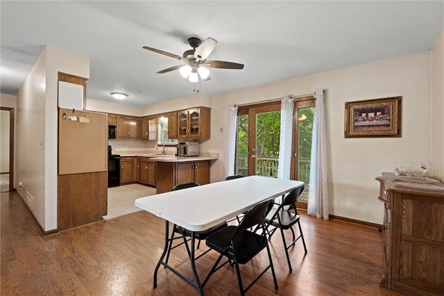 446 Hithergreen Dr, Lansing, KS 66043 - dining area with wood finished floors and a ceiling fan