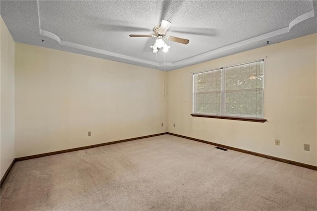 446 Hithergreen Dr, Lansing, KS 66043 - carpeted empty room with a textured ceiling, a raised ceiling, and ceiling fan