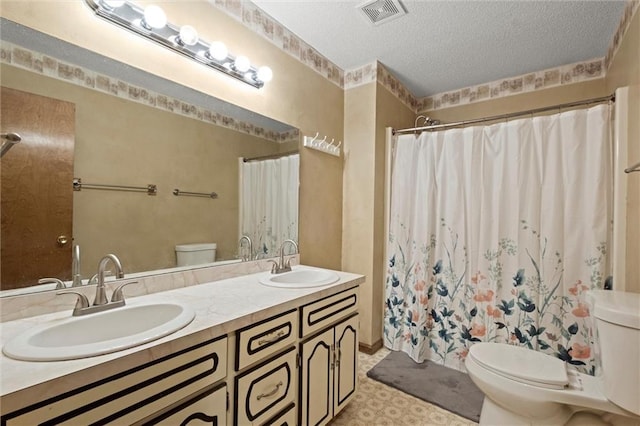 446 Hithergreen Dr, Lansing, KS 66043 - bathroom featuring a textured ceiling, double vanity, and a shower with shower curtain