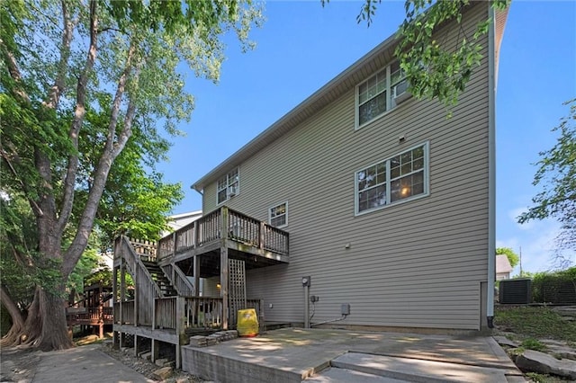 446 Hithergreen Dr, Lansing, KS 66043 - rear view of property with a wooden deck, a patio, and stairs
