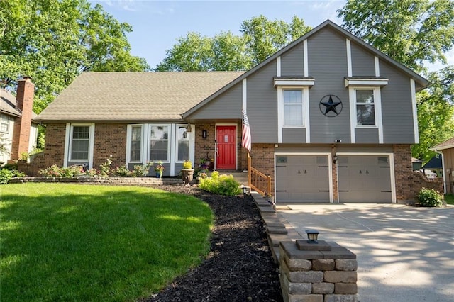 1504 SW 9th St, Lees Summit, MO 64081 - tri-level home with brick siding, a garage, concrete driveway, and a front lawn