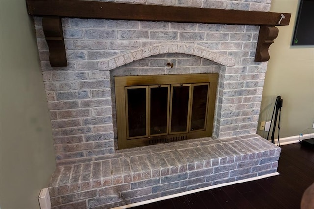 1504 SW 9th St, Lees Summit, MO 64081 - detailed view of wood finished floors and a fireplace