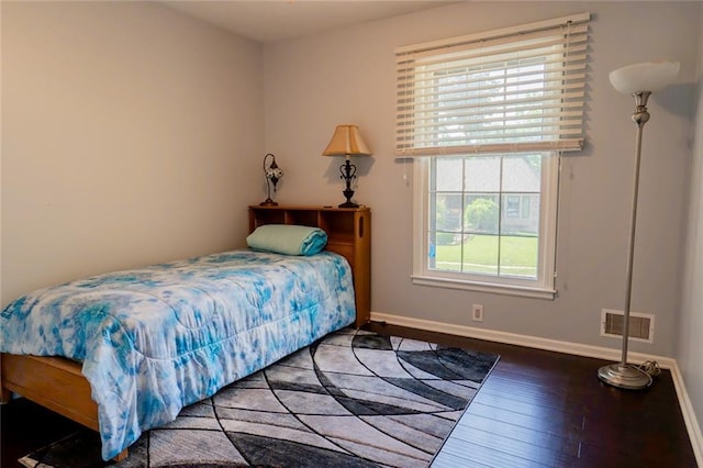 1504 SW 9th St, Lees Summit, MO 64081 - bedroom with wood-type flooring and baseboards