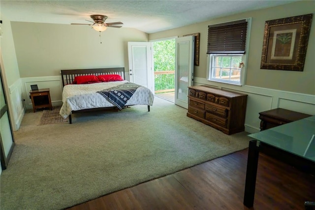 1504 SW 9th St, Lees Summit, MO 64081 - bedroom featuring access to outside, wainscoting, wood finished floors, a decorative wall, and a ceiling fan