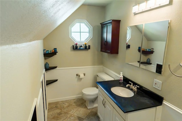 1504 SW 9th St, Lees Summit, MO 64081 - bathroom with vaulted ceiling, vanity, and tile patterned floors