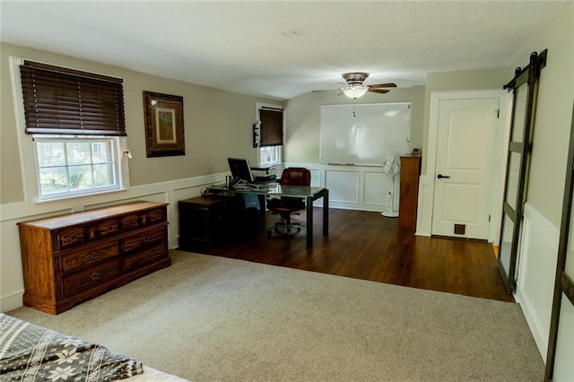 1504 SW 9th St, Lees Summit, MO 64081 - home office with a decorative wall, ceiling fan, carpet, a wainscoted wall, and wood finished floors