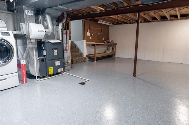 1504 SW 9th St, Lees Summit, MO 64081 - unfinished below grade area featuring washer / dryer, heating unit, and stairs