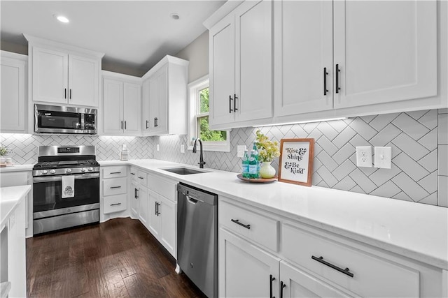 19714 W 197th Ct, Spring Hill, KS 66083 - kitchen with stainless steel appliances, a sink, light countertops, white cabinetry, and recessed lighting