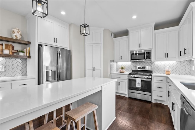 19714 W 197th Ct, Spring Hill, KS 66083 - kitchen featuring appliances with stainless steel finishes, decorative backsplash, white cabinets, and recessed lighting