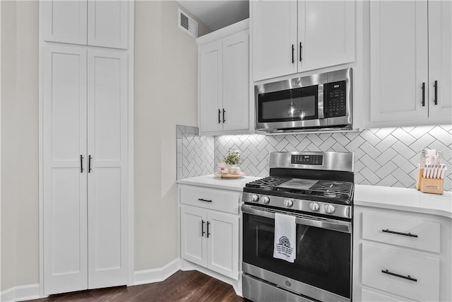 19714 W 197th Ct, Spring Hill, KS 66083 - kitchen with appliances with stainless steel finishes, light countertops, tasteful backsplash, and white cabinetry