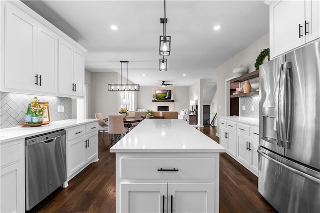 19714 W 197th Ct, Spring Hill, KS 66083 - kitchen featuring appliances with stainless steel finishes, decorative backsplash, dark wood-type flooring, open floor plan, and recessed lighting