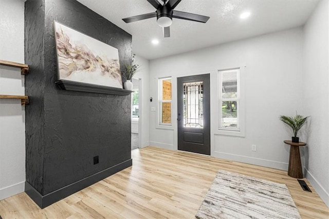 1115 S Leslie St, Independence, MO 64050 - entryway with healthy amount of natural light, wood finished floors, recessed lighting, and a ceiling fan
