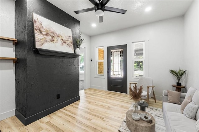 1115 S Leslie St, Independence, MO 64050 - entryway with wood finished floors, plenty of natural light, recessed lighting, and a ceiling fan