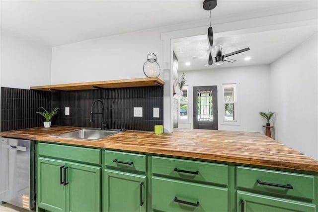 1115 S Leslie St, Independence, MO 64050 - kitchen featuring wooden counters, green cabinetry, dishwasher, backsplash, and recessed lighting