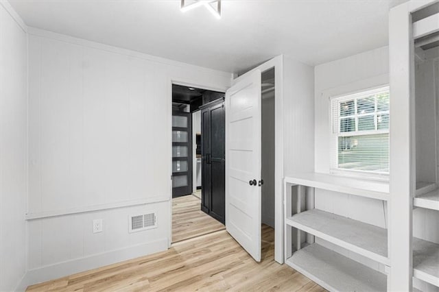 1115 S Leslie St, Independence, MO 64050 - unfurnished bedroom featuring wood finished floors