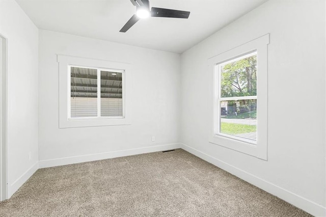 1115 S Leslie St, Independence, MO 64050 - unfurnished room featuring carpet floors and ceiling fan
