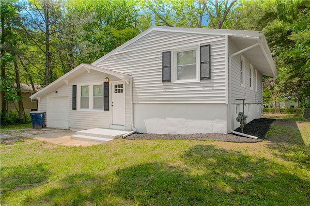 11300 Greenwood Rd, Kansas City, MO 64134 - view of front of house with a front lawn and an attached garage