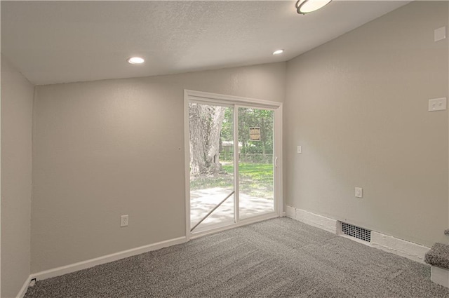 11300 Greenwood Rd, Kansas City, MO 64134 - spare room featuring carpet flooring, vaulted ceiling, recessed lighting, a textured ceiling, and baseboards