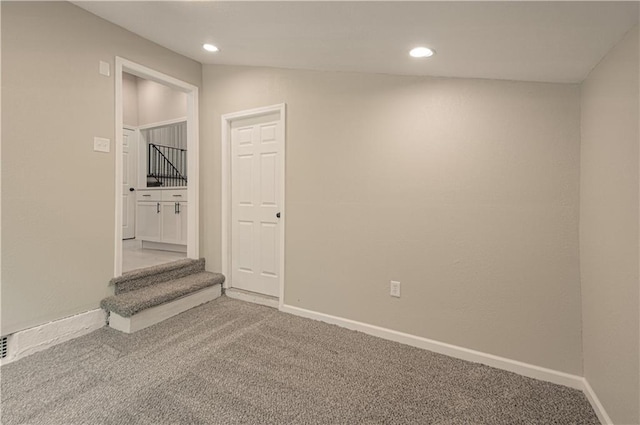 11300 Greenwood Rd, Kansas City, MO 64134 - carpeted spare room with recessed lighting, baseboards, and stairs