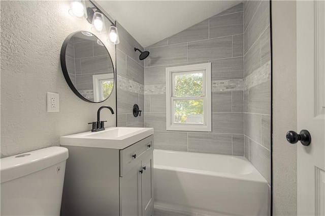 11300 Greenwood Rd, Kansas City, MO 64134 - bathroom with vaulted ceiling, vanity, shower / bathtub combination, toilet, and a textured wall