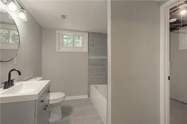 11300 Greenwood Rd, Kansas City, MO 64134 - full bath featuring vanity, toilet, a textured ceiling, baseboards, and a textured wall