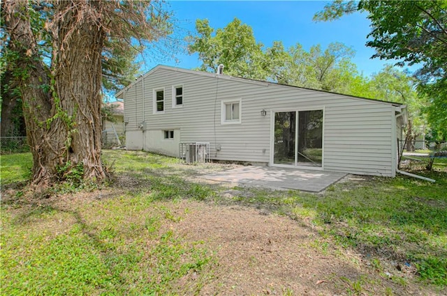 11300 Greenwood Rd, Kansas City, MO 64134 - back of house featuring a patio and cooling unit
