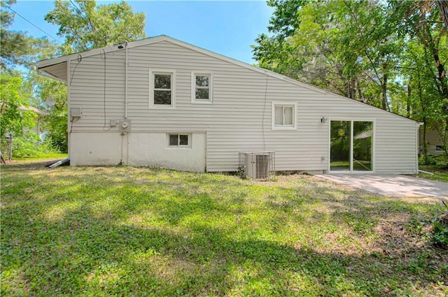 11300 Greenwood Rd, Kansas City, MO 64134 - rear view of property with central AC unit, a yard, and a patio area