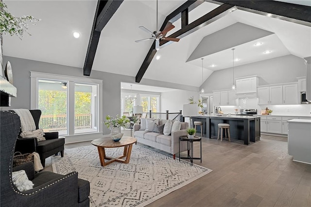 19433 W 114th Ter, Olathe, KS 66061 - living area featuring ceiling fan, high vaulted ceiling, recessed lighting, light wood finished floors, and beamed ceiling